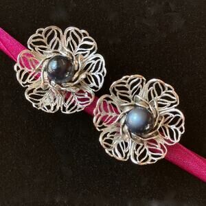 Open-work metal flowers, cat's eye cabochon, clip-on earrings